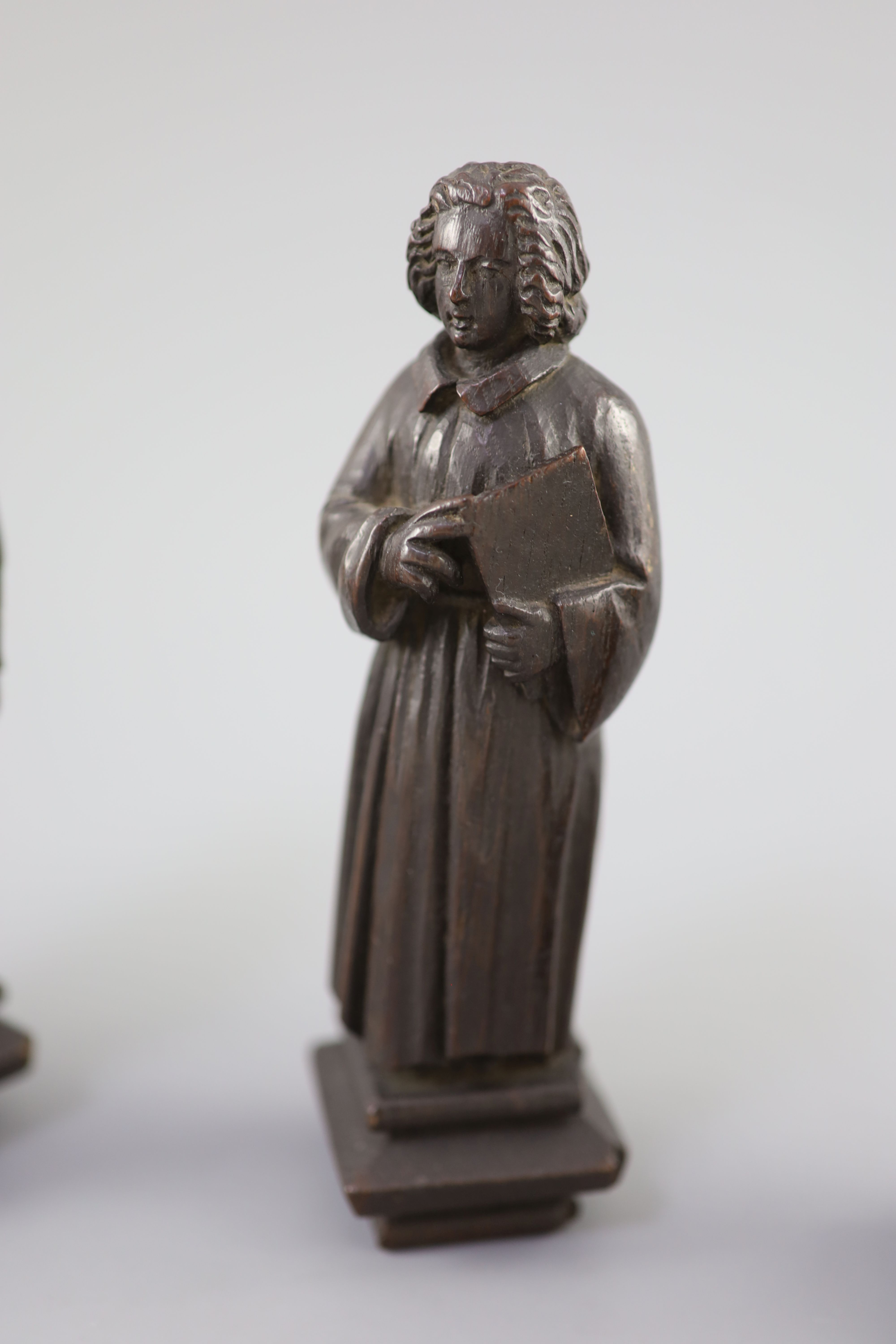 Four English oak figures of Evangelists, three possibly c.1425-50, one a 19th century copy, from Romsey Abbey? 19cm high Provenance - A